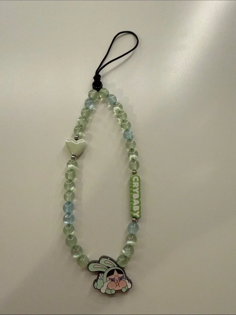Green Beaded Phone Wristlet with 'Crybaby' Accent and Heart Charm